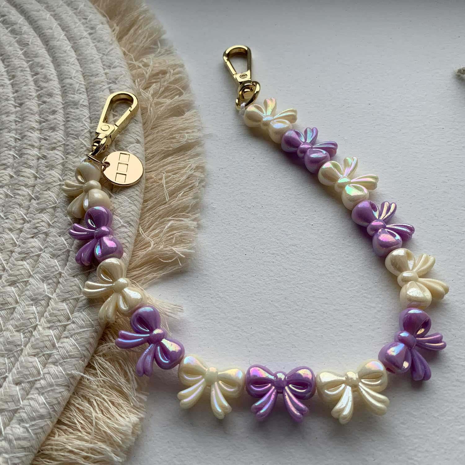 Cordon de téléphone Bow - violet blanc - or