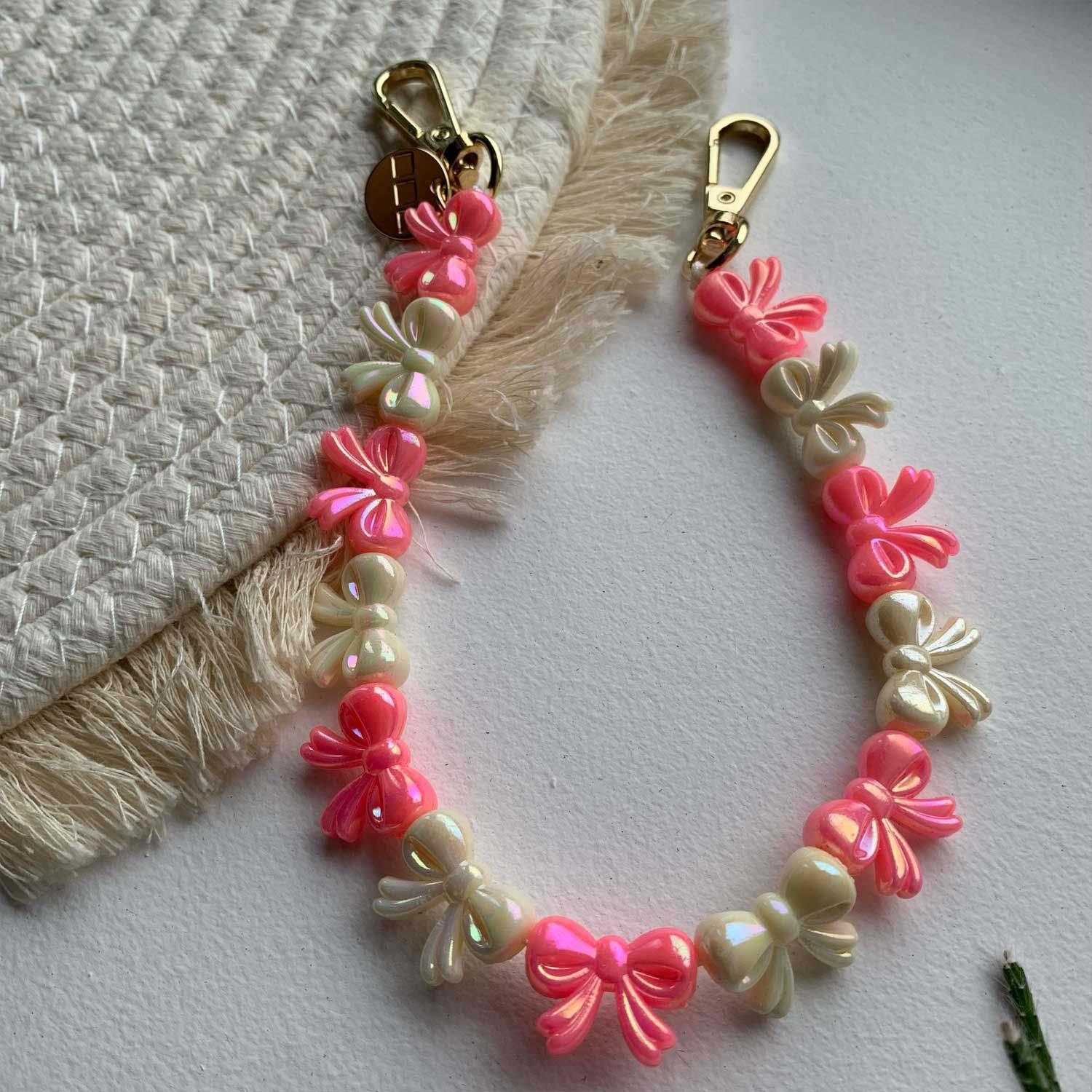 Telefoonkoord Bow - roze wit - goud