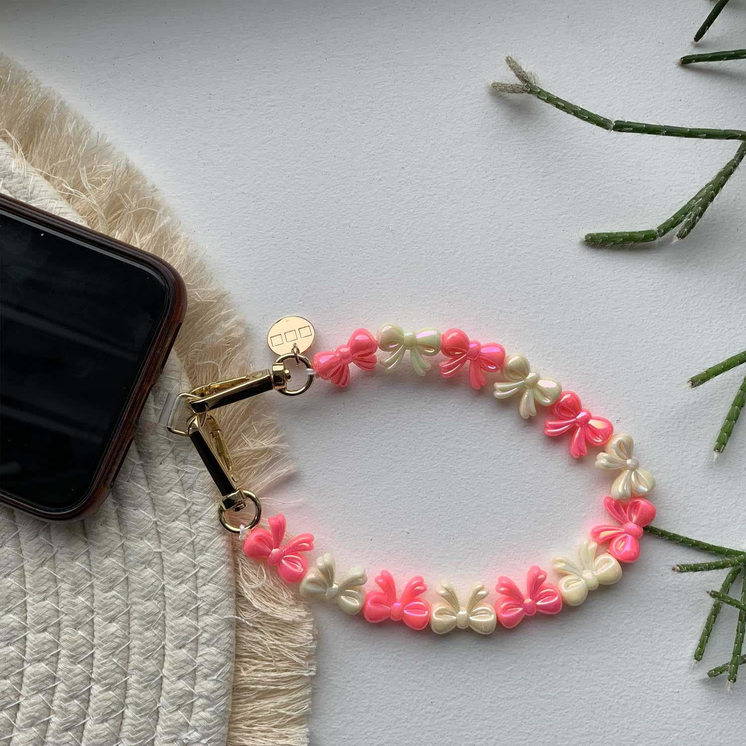 Telefoonkoord Bow - roze wit - goud