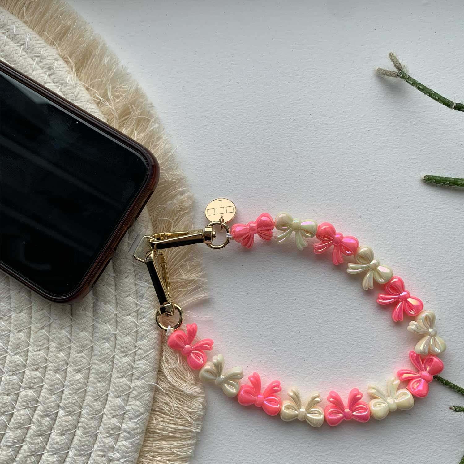 Telefoonkoord Bow - roze wit - goud